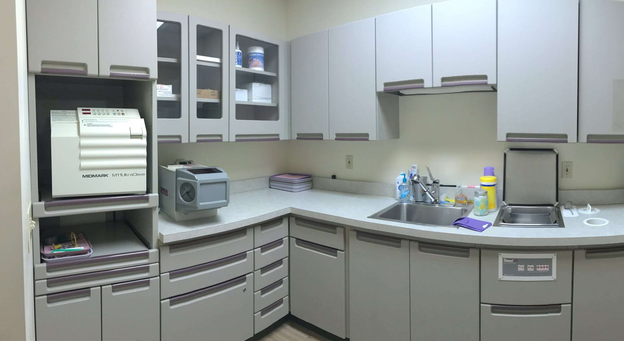 Our instrument sterilization room, with the autoclave, sinks and cabinets