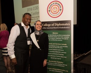 El-Refai in front of College of Diplomates sign