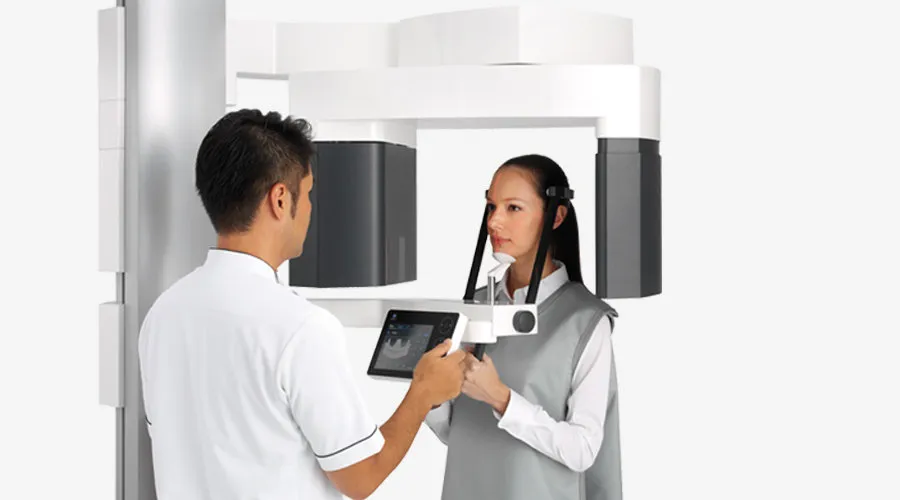 Doctor and patient using the Cone Beam CT Scanner