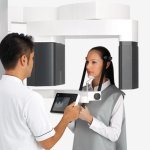 Doctor and patient using the Cone Beam CT Scanner